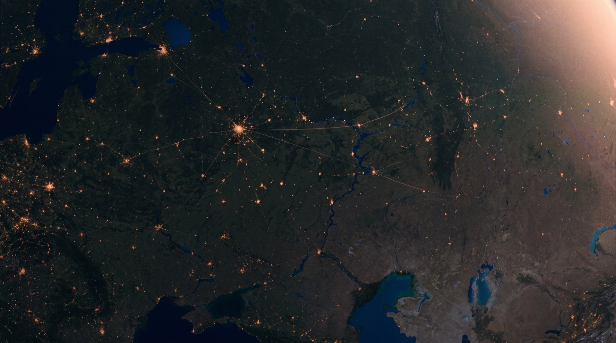 Aerial night-to-dawn view of Indonesian regions with points of light marking farms, laboratories and facilities